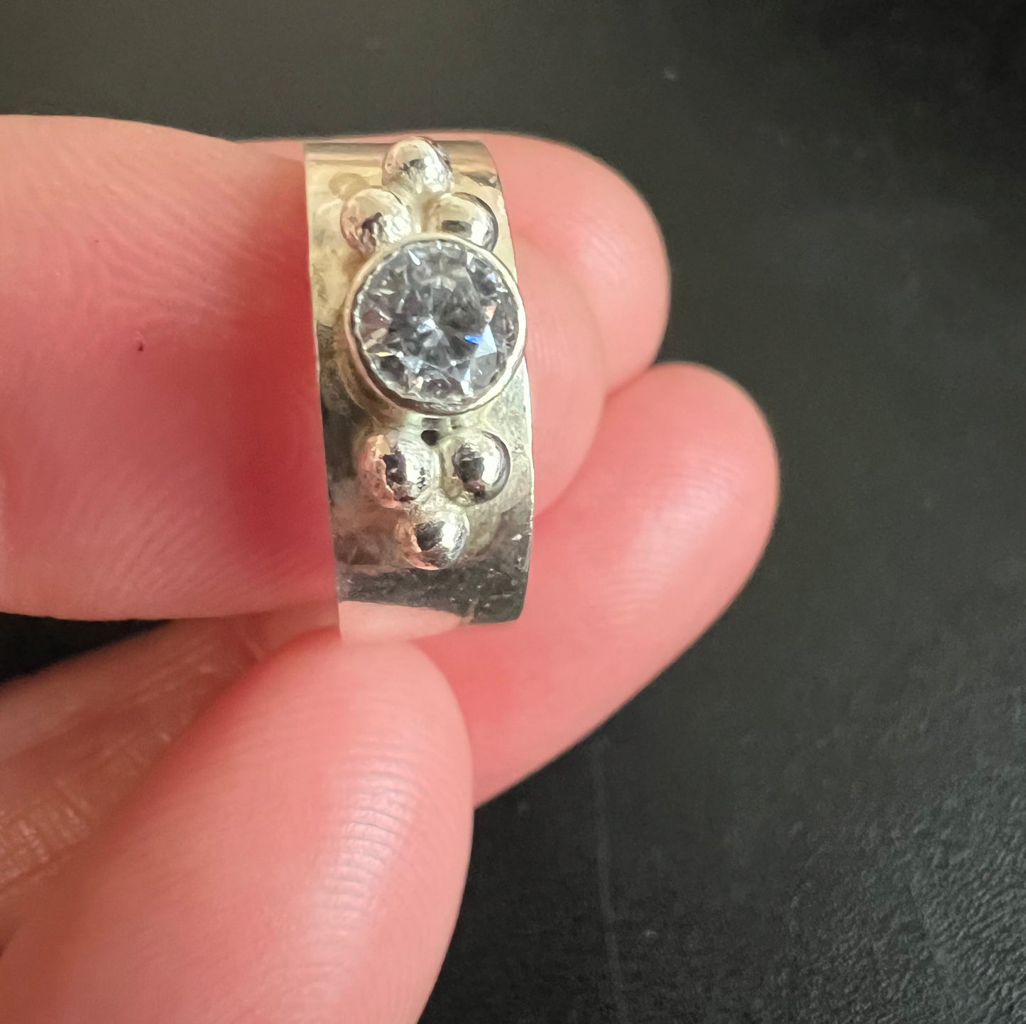 Sterling Silver with diamond and silver balls on each side